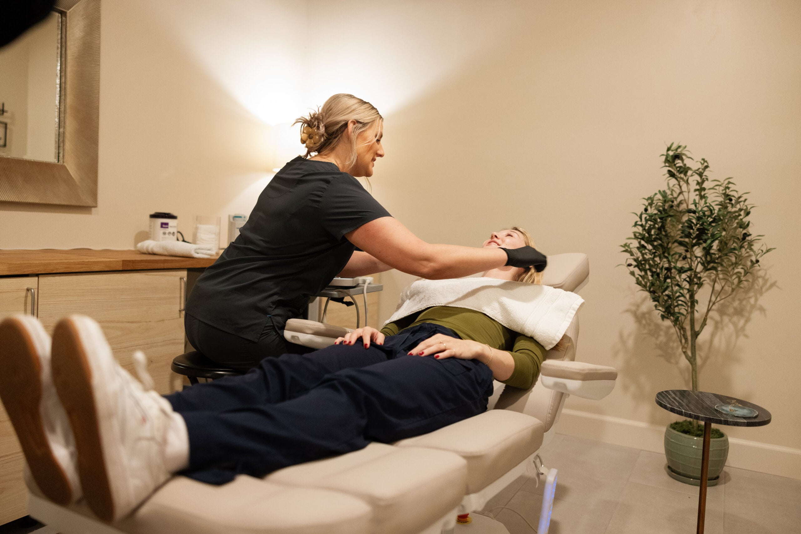 Natalie performing a concierge ultrasound for a patient at home