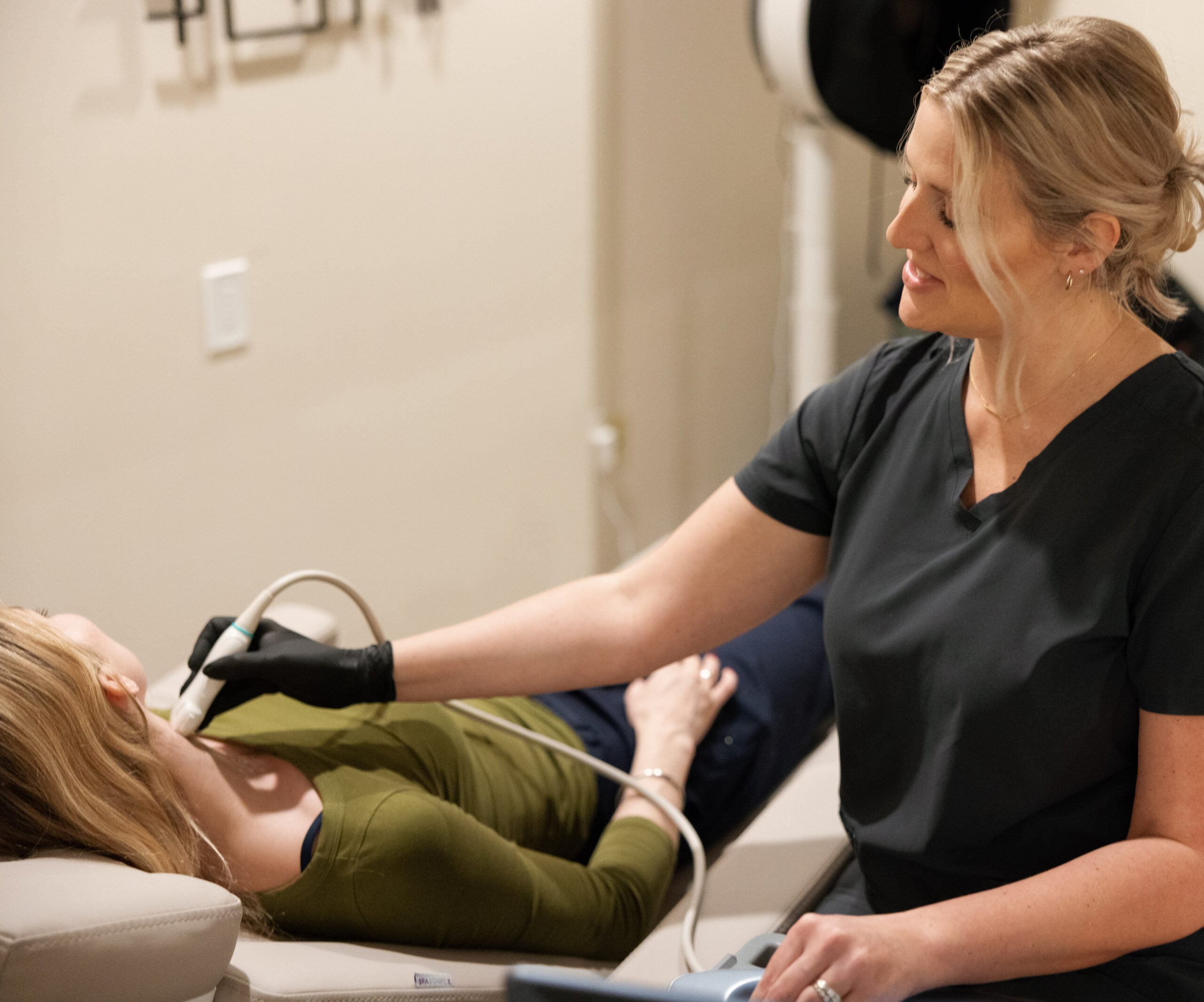 Natalie performing a carotid ultrasound on a patient's neck