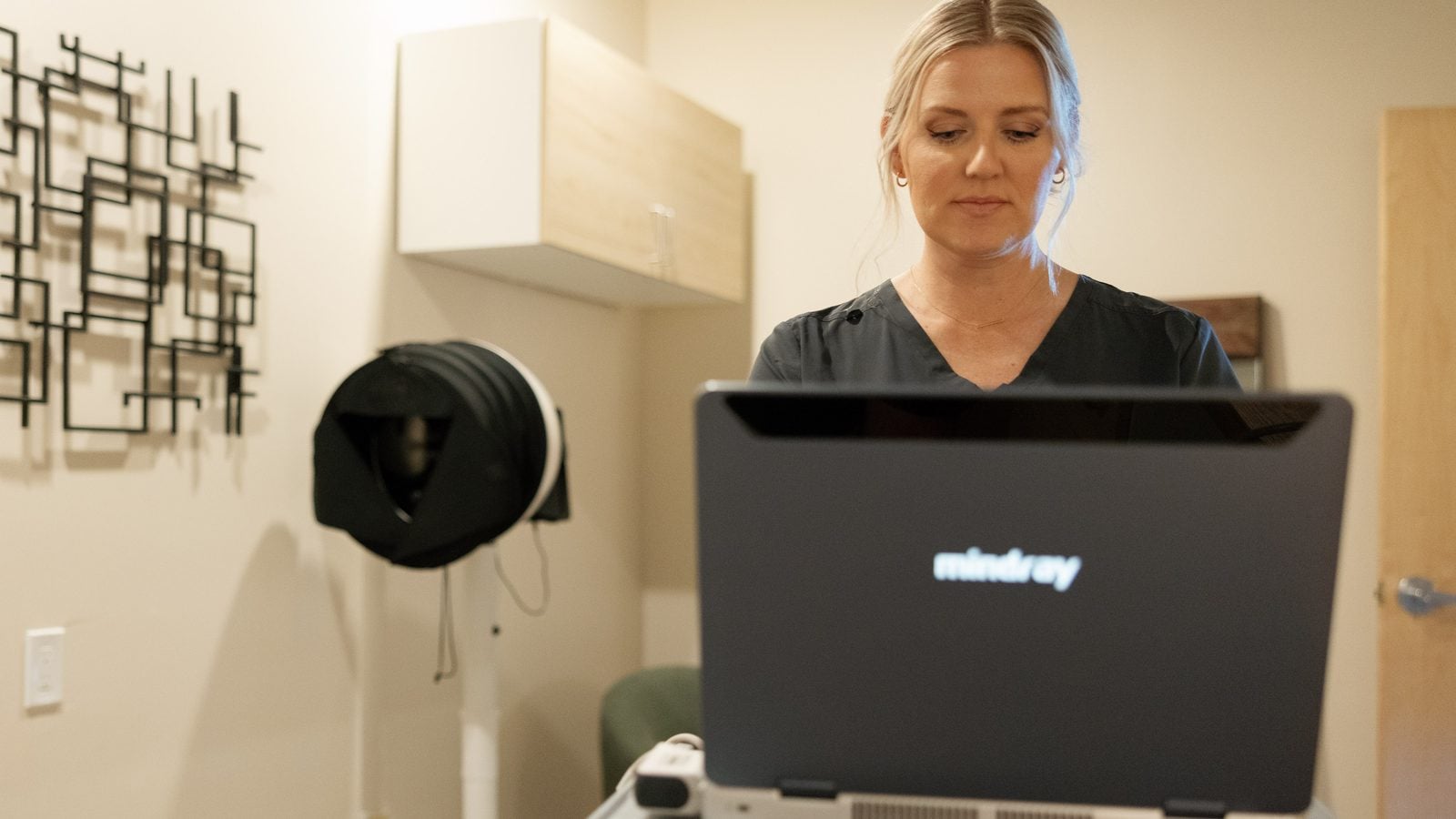 Private exam room with a portable ultrasound system