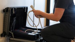 Sonographer unpacking a portable ultrasound for a home visit